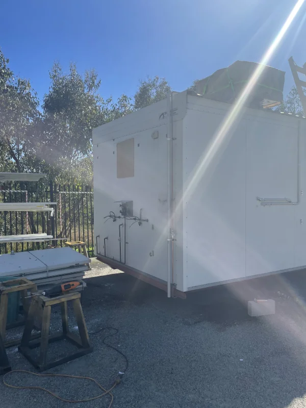 transportable building next to a table and chair